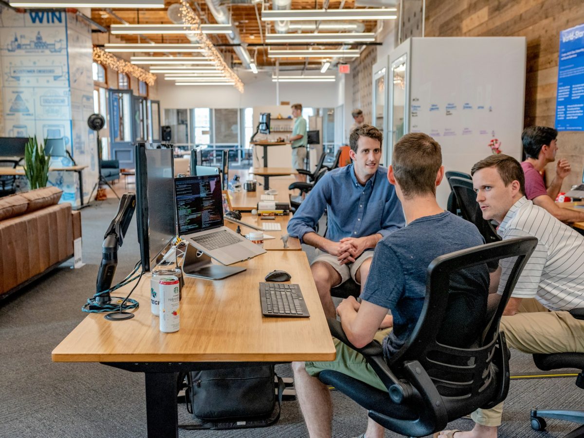 Colleagues working together in an open-plan office